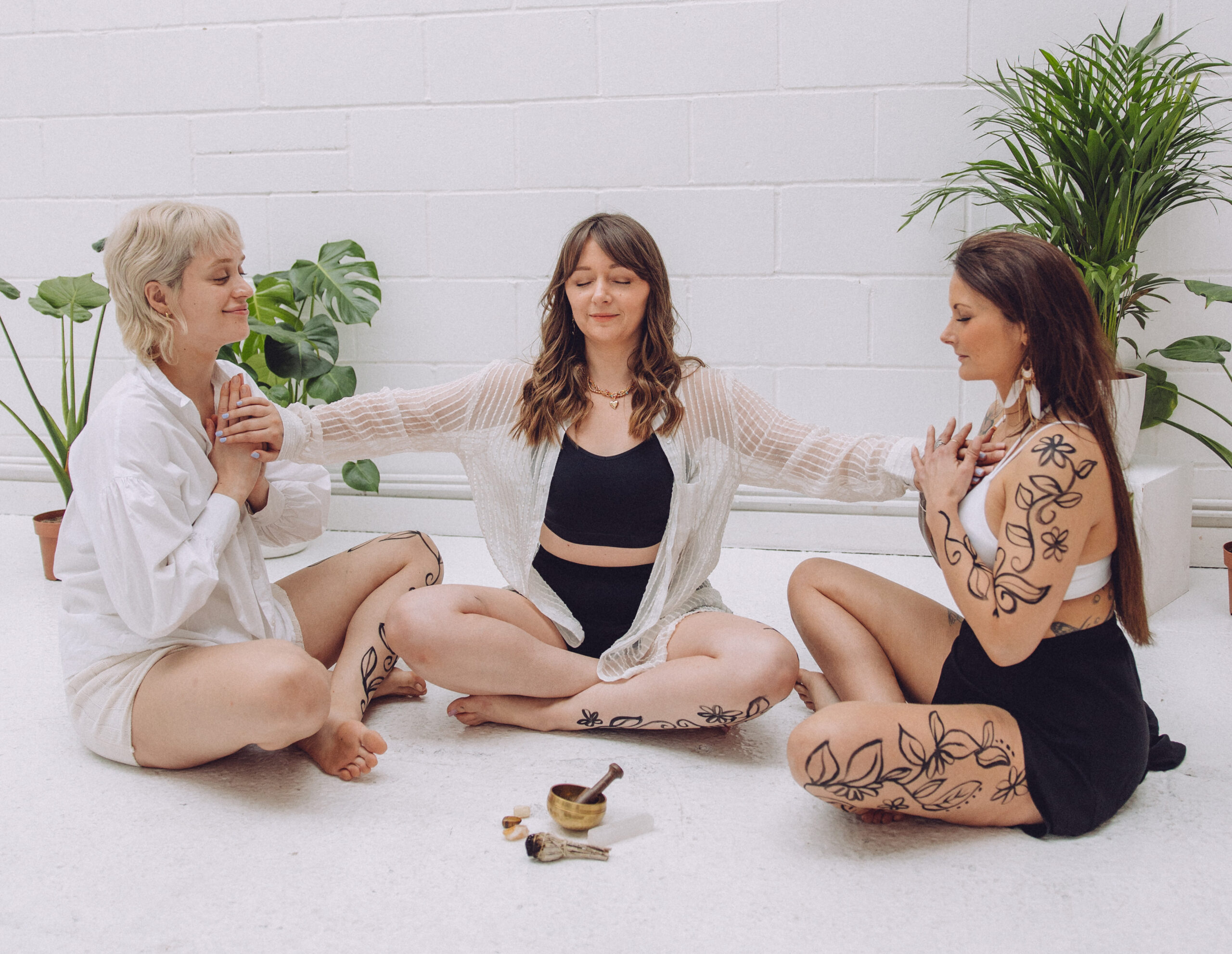 a group of spiritual women meditating together